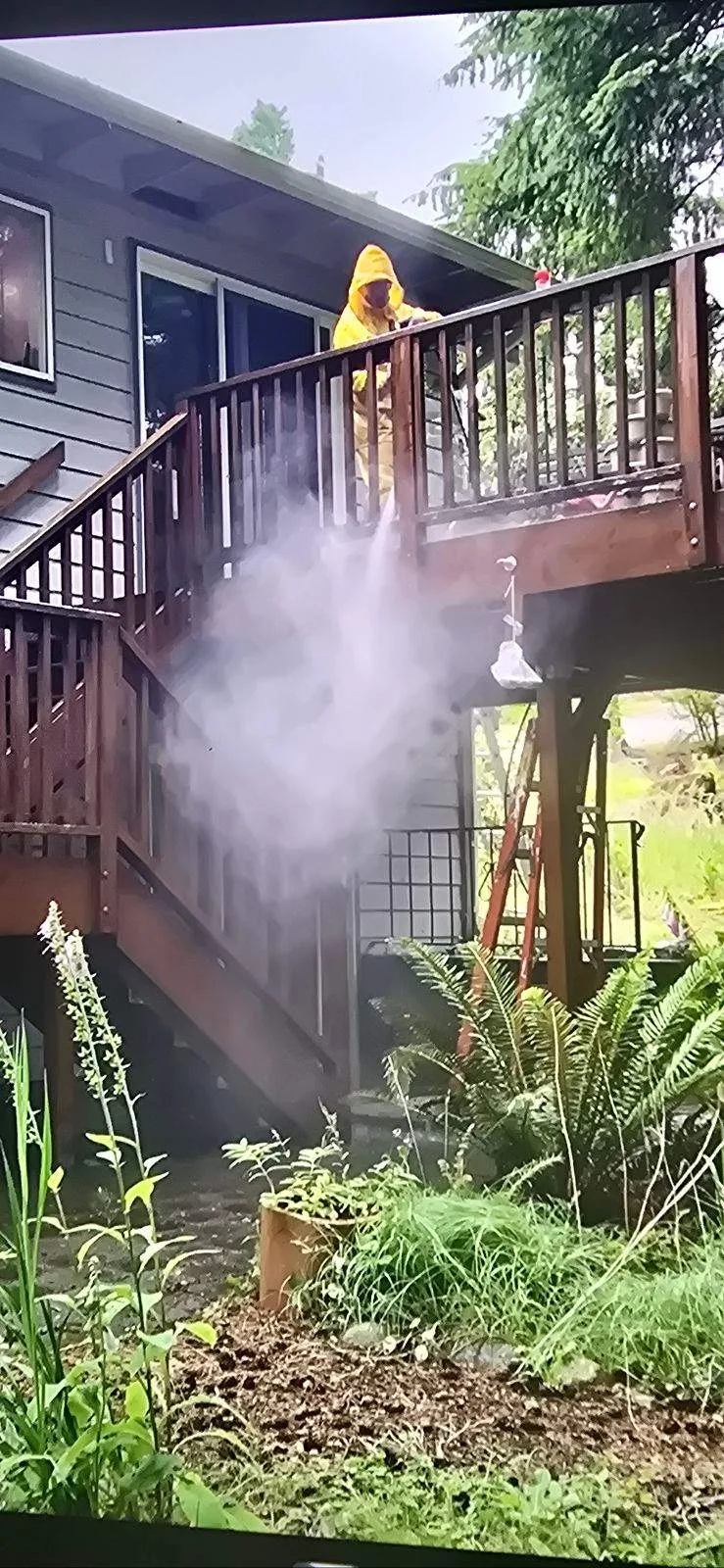 Pressure washing deck stairs and railing in Bothell